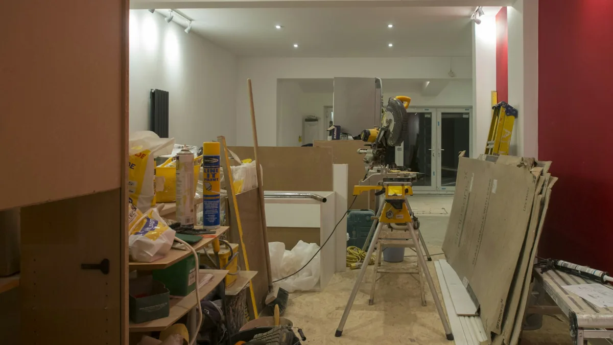 Home interior under renovation with exposed walls and construction materials